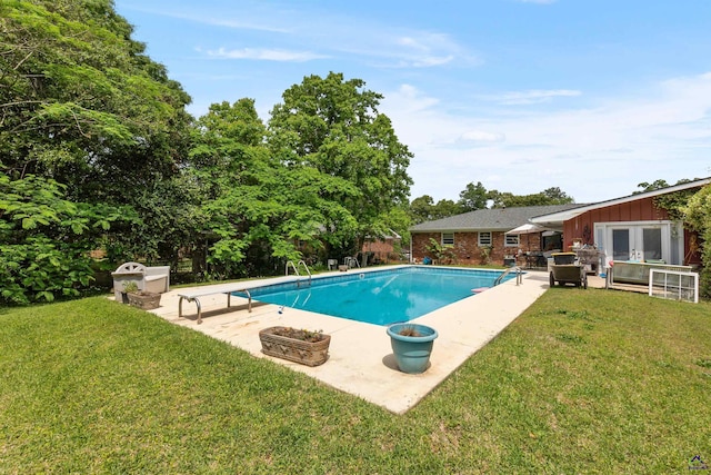 113 Chestnut Rd, Warner Robins, GA 31088 - swimming pool with french doors, a patio, and a yard