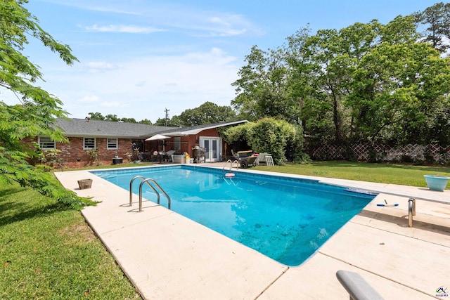 113 Chestnut Rd, Warner Robins, GA 31088 - view of swimming pool with a patio area, a yard, a diving board, and french doors