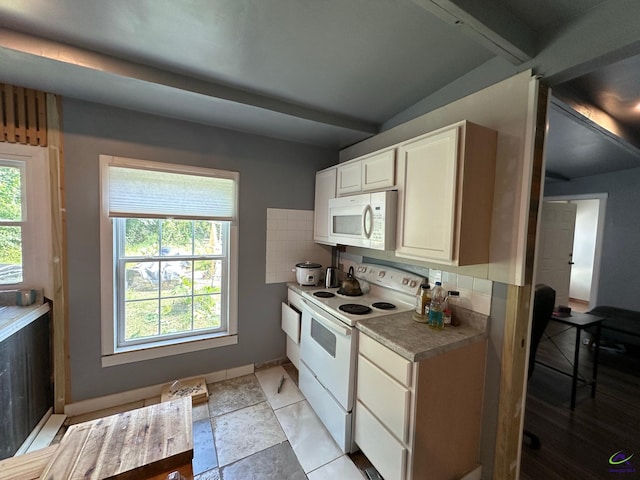 2017 Lowe St, Macon, GA 31204 - kitchen featuring white appliances, tasteful backsplash, beamed ceiling, and light countertops