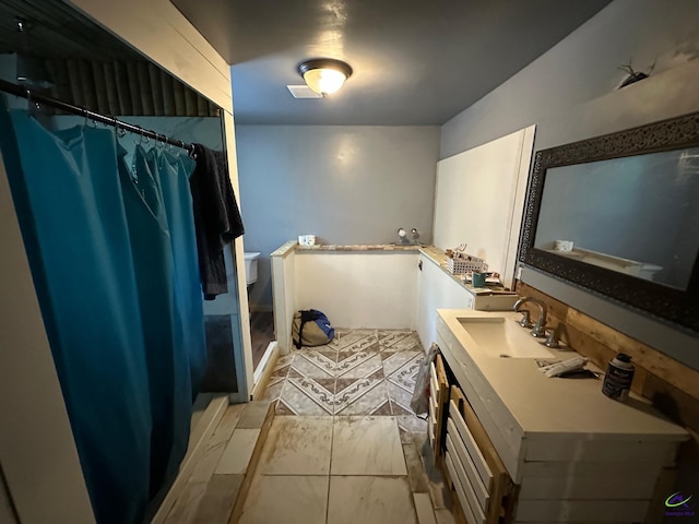 2017 Lowe St, Macon, GA 31204 - bathroom featuring vanity and curtained shower