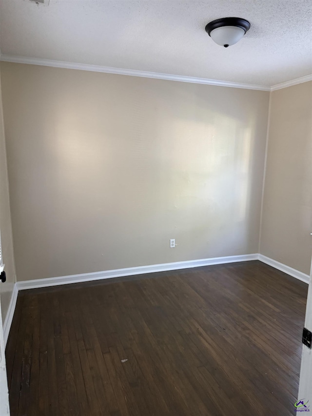 314 Arnold Blvd, Warner Robins, GA 31093 - spare room featuring dark wood-style flooring, crown molding, and a textured ceiling