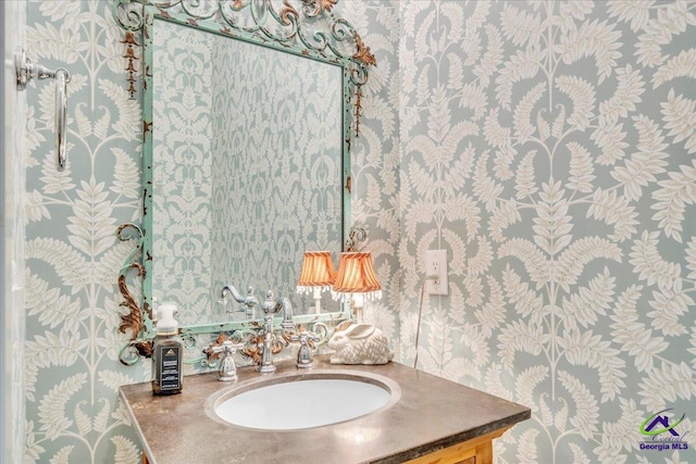 117 Pine Bough Trl, Perry, GA 31609 - bathroom featuring wallpapered walls and vanity