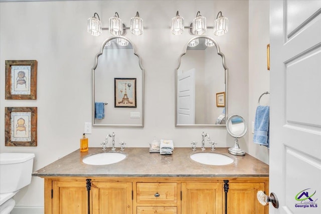 117 Pine Bough Trl, Perry, GA 31609 - bathroom featuring toilet and double vanity