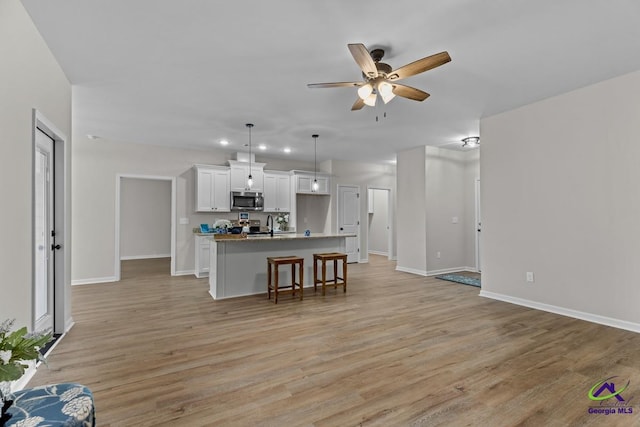 3055 Cellar Ln, Perry, GA 31069 - living room featuring light wood-style floors and ceiling fan