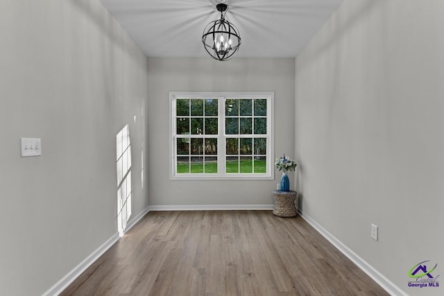 3055 Cellar Ln, Perry, GA 31069 - spare room with a chandelier and wood finished floors