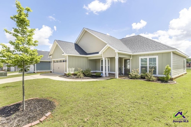 102 Sugar Creek Trl, Perry, GA 31069 - view of front of house with an attached garage, a shingled roof, a front lawn, concrete driveway, and board and batten siding
