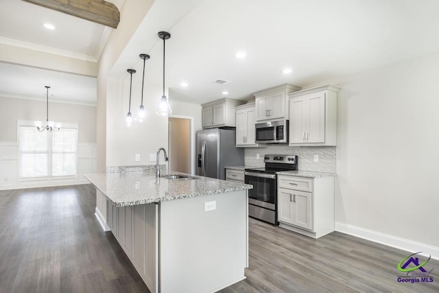 102 Sugar Creek Trl, Perry, GA 31069 - kitchen with appliances with stainless steel finishes, tasteful backsplash, crown molding, dark wood-style flooring, and a peninsula