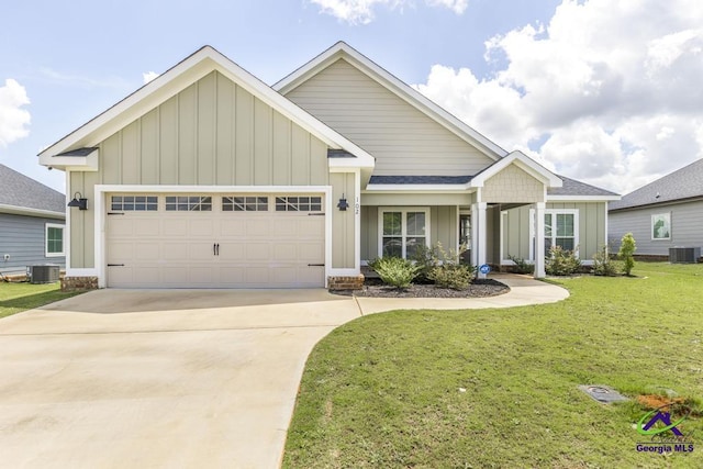 102 Sugar Creek Trl, Perry, GA 31069 - view of front facade with board and batten siding, a garage, a front lawn, and concrete driveway
