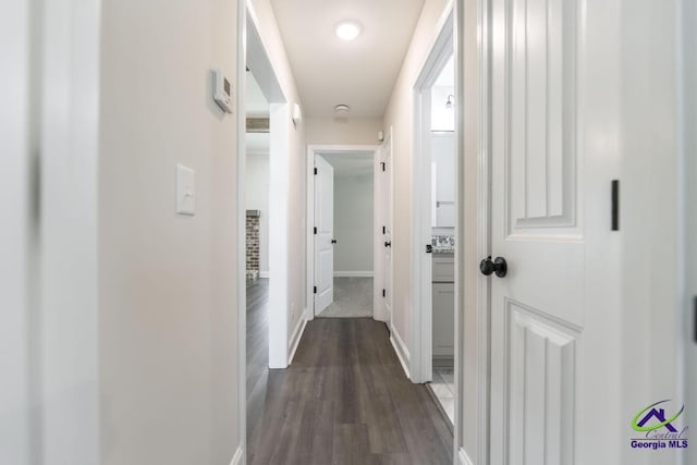 102 Sugar Creek Trl, Perry, GA 31069 - hallway featuring dark wood finished floors and baseboards