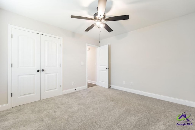 102 Sugar Creek Trl, Perry, GA 31069 - unfurnished bedroom with carpet flooring, a closet, and a ceiling fan