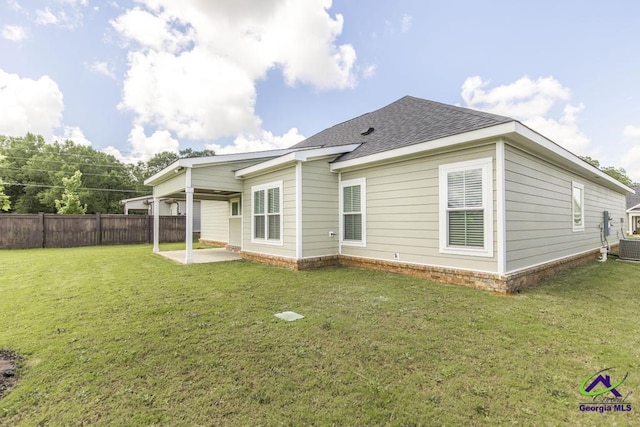 102 Sugar Creek Trl, Perry, GA 31069 - back of property featuring a patio area and a shingled roof