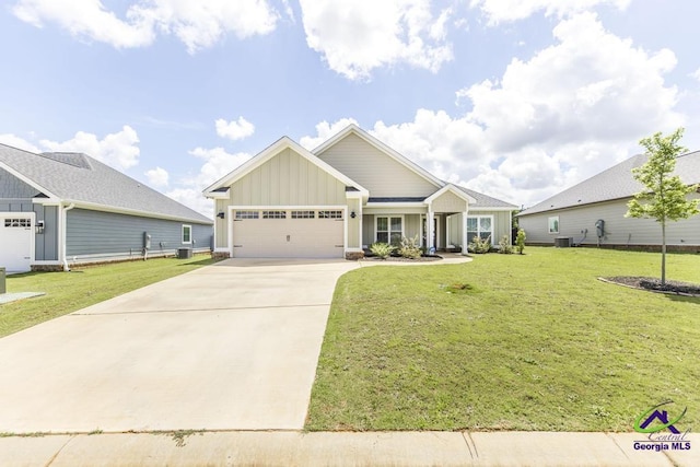 102 Sugar Creek Trl, Perry, GA 31069 - craftsman-style house featuring board and batten siding, a garage, concrete driveway, and a front yard