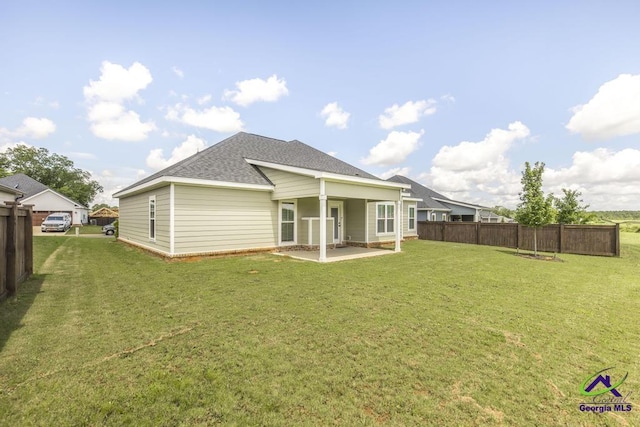 102 Sugar Creek Trl, Perry, GA 31069 - rear view of property featuring a shingled roof and a patio