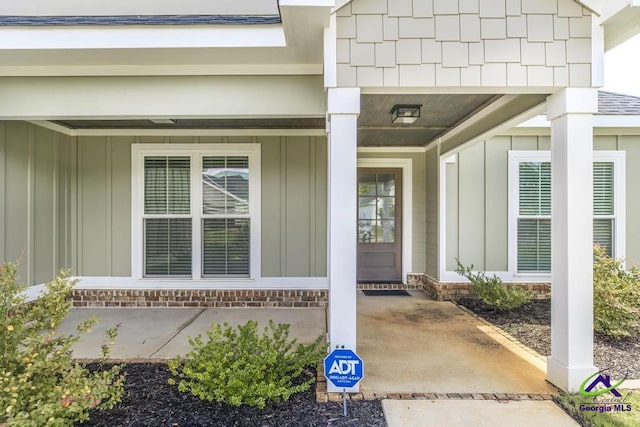 102 Sugar Creek Trl, Perry, GA 31069 - view of exterior entry featuring board and batten siding and a porch