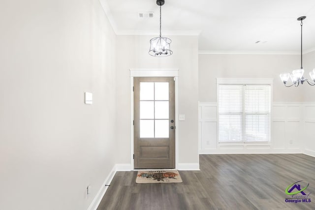 102 Sugar Creek Trl, Perry, GA 31069 - entryway with a chandelier, wood finished floors, plenty of natural light, and crown molding