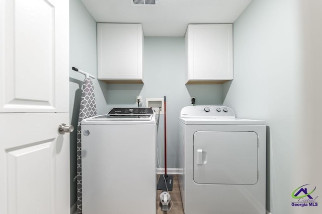 546 Grove Ln, Kathleen, GA 31047 - laundry area featuring cabinet space and washer and dryer