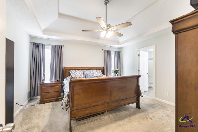 546 Grove Ln, Kathleen, GA 31047 - bedroom featuring a raised ceiling, light colored carpet, ensuite bath, and a ceiling fan