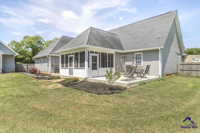 546 Grove Ln, Kathleen, GA 31047 - rear view of house featuring a patio area, roof with shingles, a sunroom, and a fenced backyard