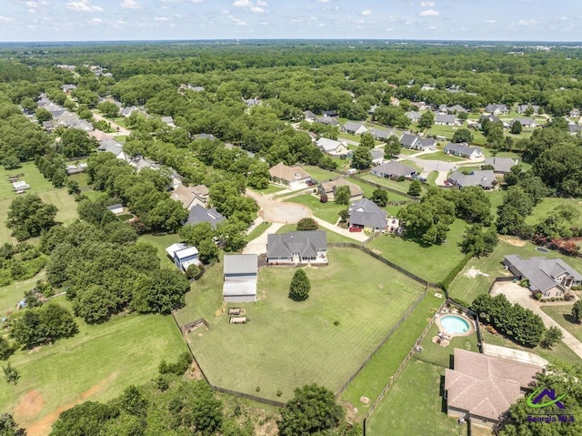 546 Grove Ln, Kathleen, GA 31047 - aerial perspective of suburban area with a heavily wooded area