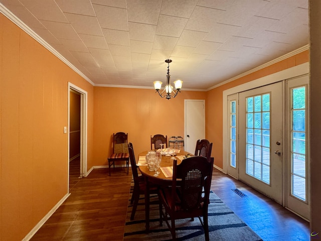 304 Mcwhorter St, Unadilla, GA 31091 - dining space featuring ornamental molding, dark wood-style floors, and a chandelier