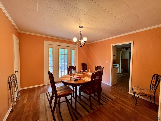 304 Mcwhorter St, Unadilla, GA 31091 - dining area featuring wood finished floors, a chandelier, and crown molding
