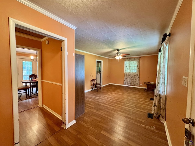 304 Mcwhorter St, Unadilla, GA 31091 - empty room featuring ornamental molding, wood finished floors, a ceiling fan, and plenty of natural light