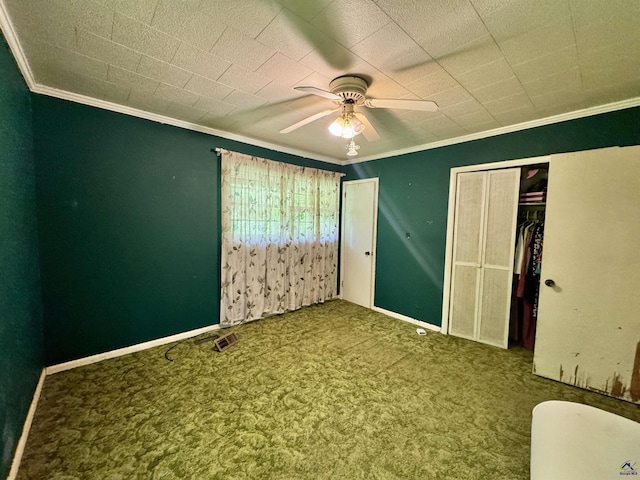 304 Mcwhorter St, Unadilla, GA 31091 - unfurnished bedroom featuring crown molding, carpet, and a ceiling fan