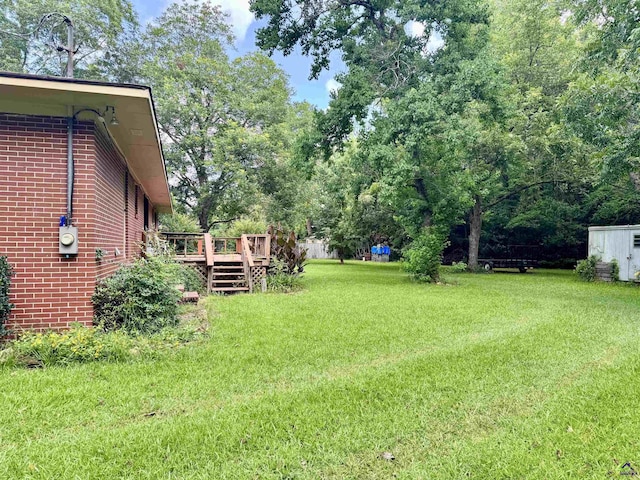 304 Mcwhorter St, Unadilla, GA 31091 - view of grassy yard with a deck