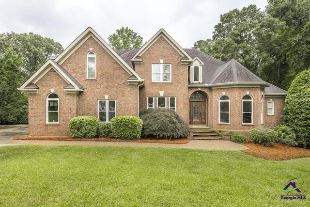 109 Black Oak Ct, Byron, GA 31008 - traditional-style home featuring brick siding, a front yard, and a shingled roof