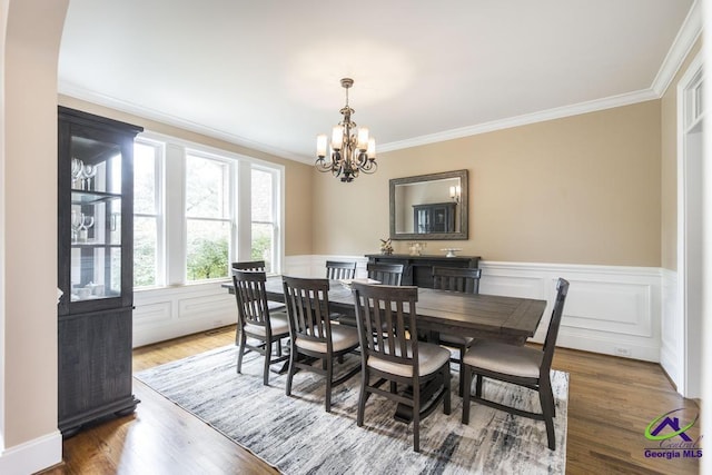 109 Black Oak Ct, Byron, GA 31008 - dining room with a chandelier, crown molding, a wainscoted wall, and wood finished floors