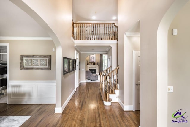 109 Black Oak Ct, Byron, GA 31008 - entrance foyer with ornamental molding, arched walkways, wood finished floors, stairs, and a high ceiling
