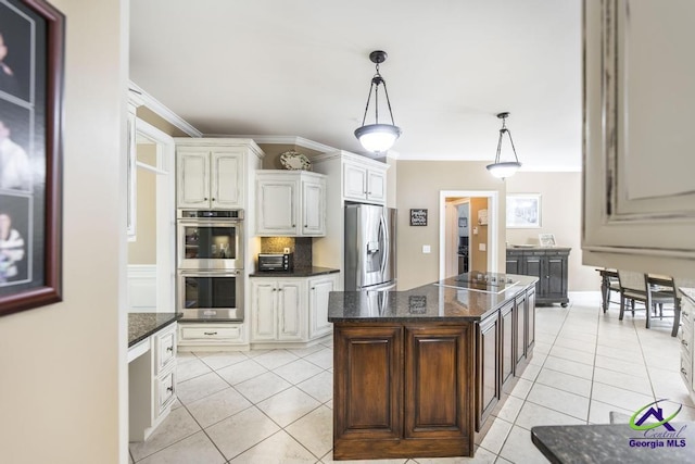 109 Black Oak Ct, Byron, GA 31008 - kitchen featuring appliances with stainless steel finishes, light tile patterned floors, decorative backsplash, and pendant lighting