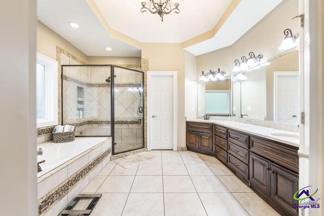 109 Black Oak Ct, Byron, GA 31008 - full bath with a garden tub, double vanity, a shower stall, tile patterned floors, and a chandelier