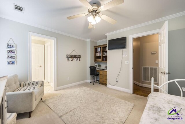 109 Black Oak Ct, Byron, GA 31008 - bedroom featuring ornamental molding, light carpet, built in desk, and a ceiling fan