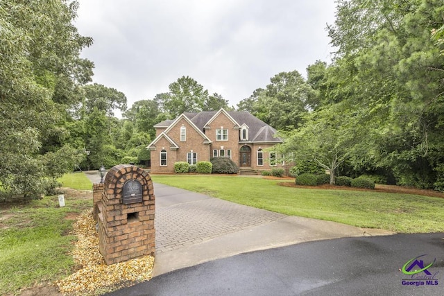 109 Black Oak Ct, Byron, GA 31008 - view of front of property featuring a front yard, brick siding, and driveway