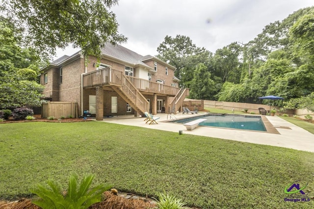 109 Black Oak Ct, Byron, GA 31008 - view of pool featuring stairs, a patio area, a fenced backyard, a wooden deck, and a diving board