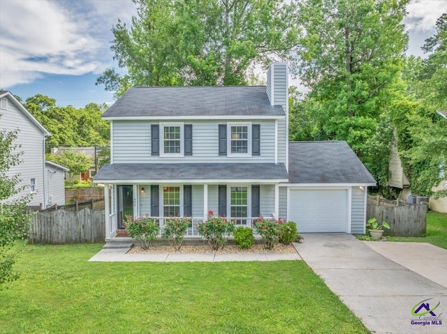 574 Shadow Moss Dr, Macon, GA 31204 - traditional-style house featuring covered porch, a garage, driveway, and a chimney