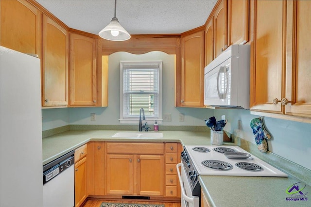 574 Shadow Moss Dr, Macon, GA 31204 - kitchen featuring white appliances, light countertops, decorative light fixtures, and a textured ceiling