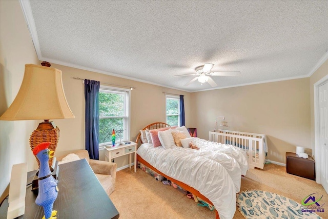 574 Shadow Moss Dr, Macon, GA 31204 - bedroom with ornamental molding, light colored carpet, a textured ceiling, and ceiling fan