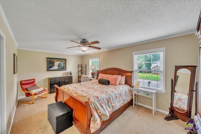 574 Shadow Moss Dr, Macon, GA 31204 - bedroom featuring crown molding, light carpet, a textured ceiling, and a ceiling fan