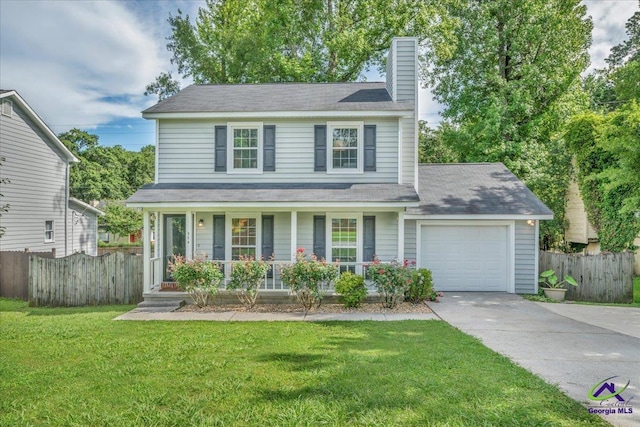 574 Shadow Moss Dr, Macon, GA 31204 - traditional home featuring a porch, an attached garage, driveway, and a chimney