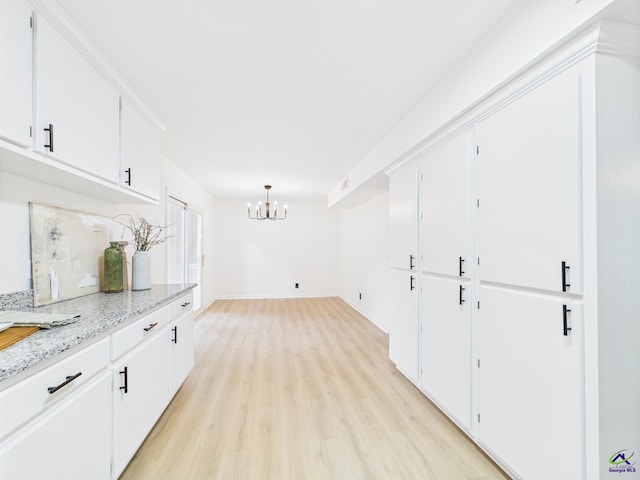 752 S Forest Lake Dr, Macon, GA 31210 - interior space with a chandelier and light wood-style flooring
