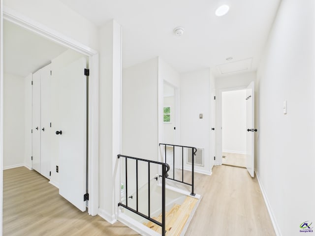 752 S Forest Lake Dr, Macon, GA 31210 - corridor with an upstairs landing, light wood-style flooring, and attic access