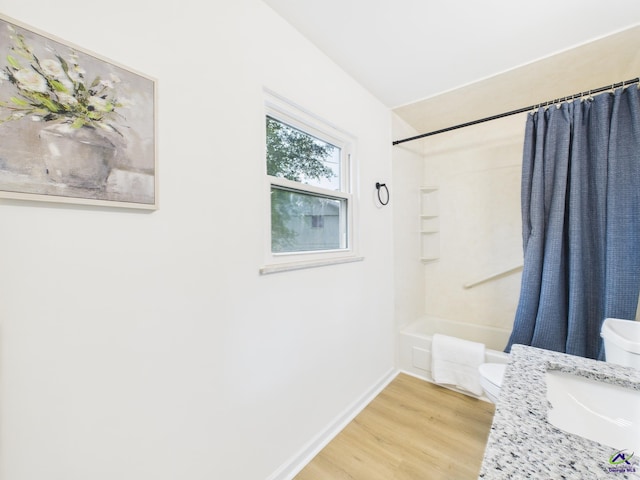 752 S Forest Lake Dr, Macon, GA 31210 - bathroom featuring wood finished floors, shower / tub combo with curtain, and vanity