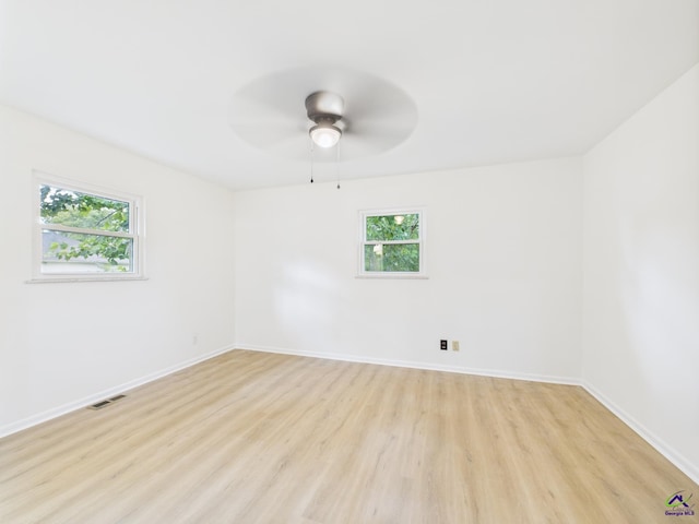 752 S Forest Lake Dr, Macon, GA 31210 - unfurnished room with light wood-style floors, healthy amount of natural light, and a ceiling fan
