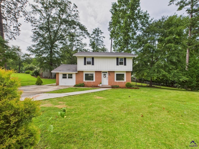 752 S Forest Lake Dr, Macon, GA 31210 - view of front facade featuring brick siding, concrete driveway, and roof with shingles