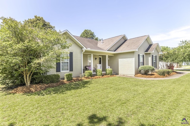 3560 S Lawrence Dr, Macon, GA 31216 - ranch-style house with covered porch, a front yard, and roof with shingles