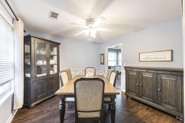 3560 S Lawrence Dr, Macon, GA 31216 - dining room with a ceiling fan, a textured ceiling, and dark wood-type flooring