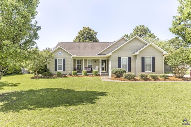 3560 S Lawrence Dr, Macon, GA 31216 - ranch-style house featuring a porch, a front lawn, and roof with shingles