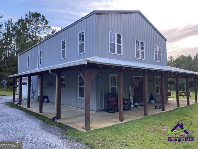 2521 Rock Springs Rd, Glenwood, GA 30428 - view of home's exterior with a patio